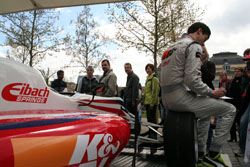 Fans Look at Car