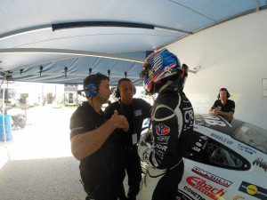 Car owner Bob Faieta with Mechanic "D" and Engineer Brad speak with Michael before the start of the Free Practice Session on Thursday, July 10.