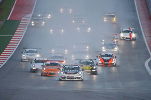 Friday's Race 1 began under wet conditions with Michael Lewis' No. 98 Competition Motorsports/Curb-Agajanian Porsche 911 setting the pace of the field as he led from the green to the checkered flag.