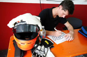 Michael Lewis is seen here studying the  track layout before taking a Porsche onto the course.