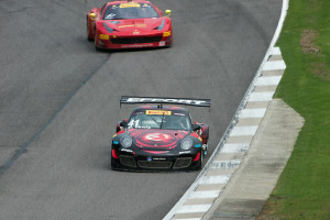 Michael Lewis is seen here at Barber Motorsports Park in the No. 41 EFFORT Racing Porsche 911 GT3 R as he leads a competitor.