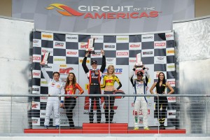 Michael Lewis on the Race 1 podium at Circuit of The Americas.