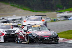 Michael Lewis and the No. 41 EFFORT Racing/Curb-Agajanian Porsche 911 GT3 R lead a pack of cars on Saturday, May 17. Michael finished the race in 8th position.