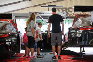 Fans are always welcome at EFFORT Racing. Here, Michael Lewis gives a tour of the paddock area and the No. 41 EFFORT Racing/Curb-Agajanian Porsche 911 GT3 R.