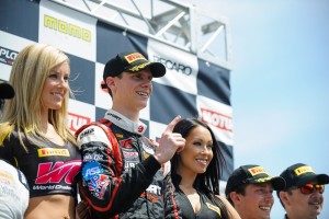 Michael Lewis stands on top of the podium for the third consecutive race after earning his third victory in the GTA class of the Pirelli World Challenge, this time at the Grand Prix of St. Petersburg on Saturday, March 28.