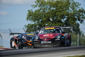 Michael Lewis holds off a challenge by Kevin Estre to earn his third consecutive 5th-place finish in Round 14 of the Pirelli World Challenge, on Saturday, August 1.