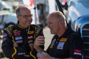 Preston Calvert and Stefan Pfeiffer discuss race strategy prior to the start of a SprintX race at Mazda Raceway Laguna Seca.